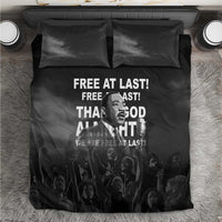 Black MLK bedding set with “Free at last” quote on duvet and two pillowcases