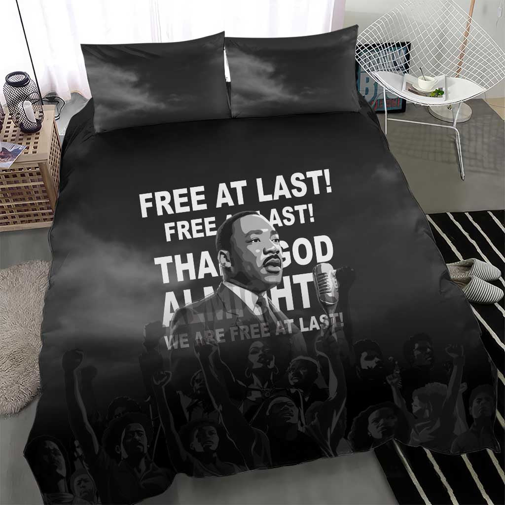 Black duvet and two pillowcases featuring “Free at last” MLK quote