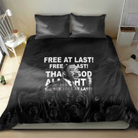 Black duvet and two pillowcases with “Free at last” MLK quote