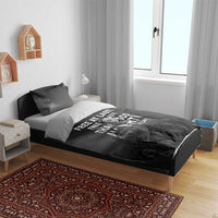 Black duvet and two pillowcases with “Free at last” MLK quote