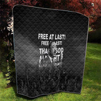 Black diamond-quilted quilt showing Martin Luther King portrait with "Free at last" text