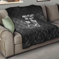 Black quilt with diamond quilting and Martin Luther King portrait, "Free at last" text
