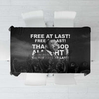 Black tablecloth with Martin Luther King Jr portrait and 'Free at last' text graphic