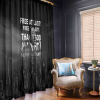 Black window curtain panel featuring Martin Luther King portrait and 'Free at last' quote