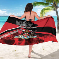 Red and black sarong with crest and wide diagonal stripes, tied at sides