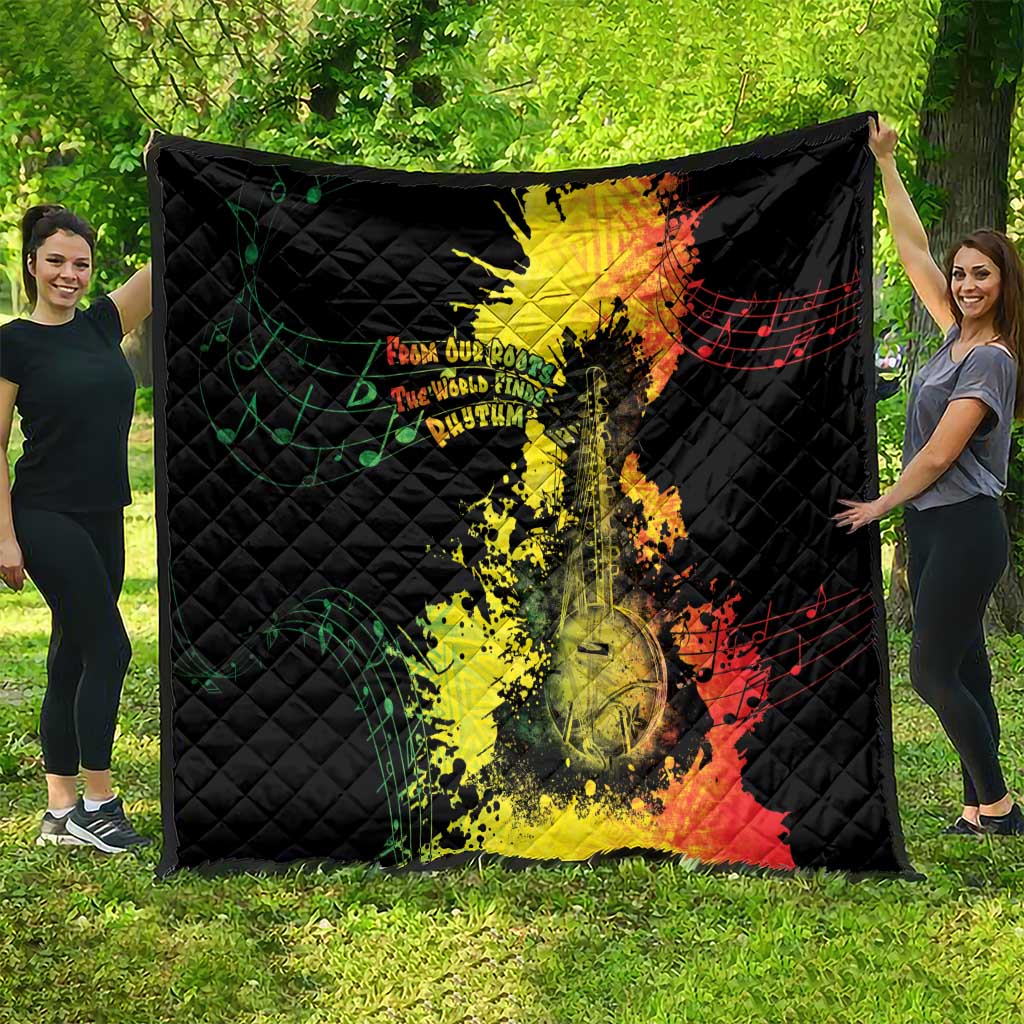 Black quilt blanket spread open on grass with Afro music portrait and notes design