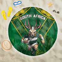 Green circular beach blanket with South Africa graphic and white fringe edge.