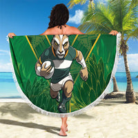 Green circular beach blanket with South Africa mascot artwork and white fringe edge.