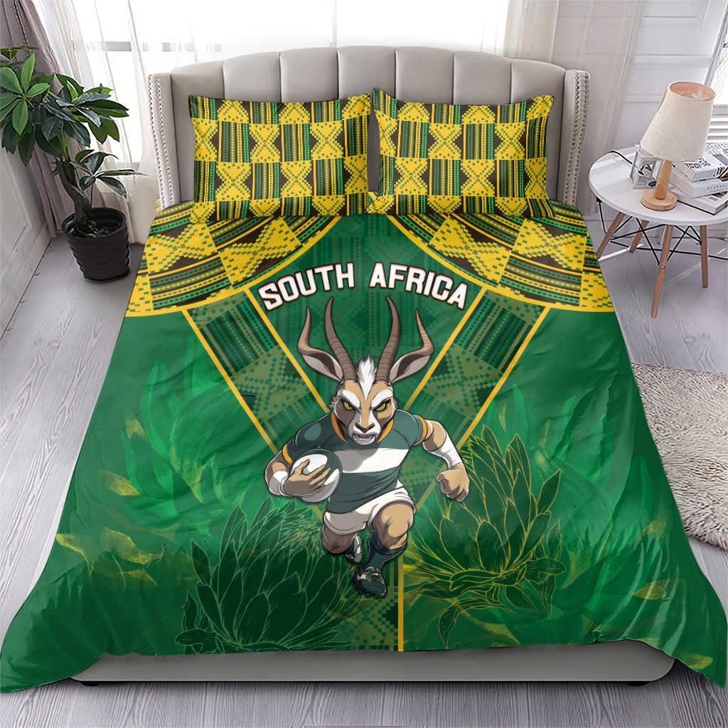 Green duvet and matching pillowcases with South Africa text, yellow pattern, and antelope mascot.