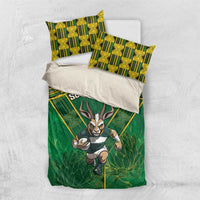 Green bedding set flat lay with South Africa text, yellow geometric pattern, and antelope graphic.