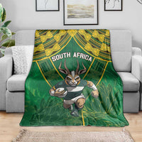 Green throw blanket featuring running springbok, "SOUTH AFRICA" headline, leafy design