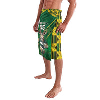 Green knee-length shorts with yellow geometric print and antelope graphic, custom 05 text