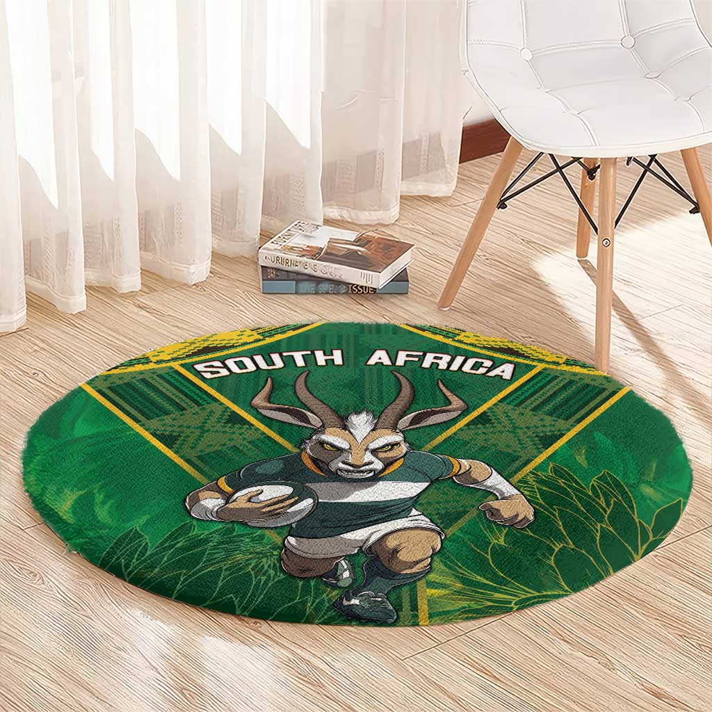 Round green rug with yellow border, South Africa lettering and antelope mascot