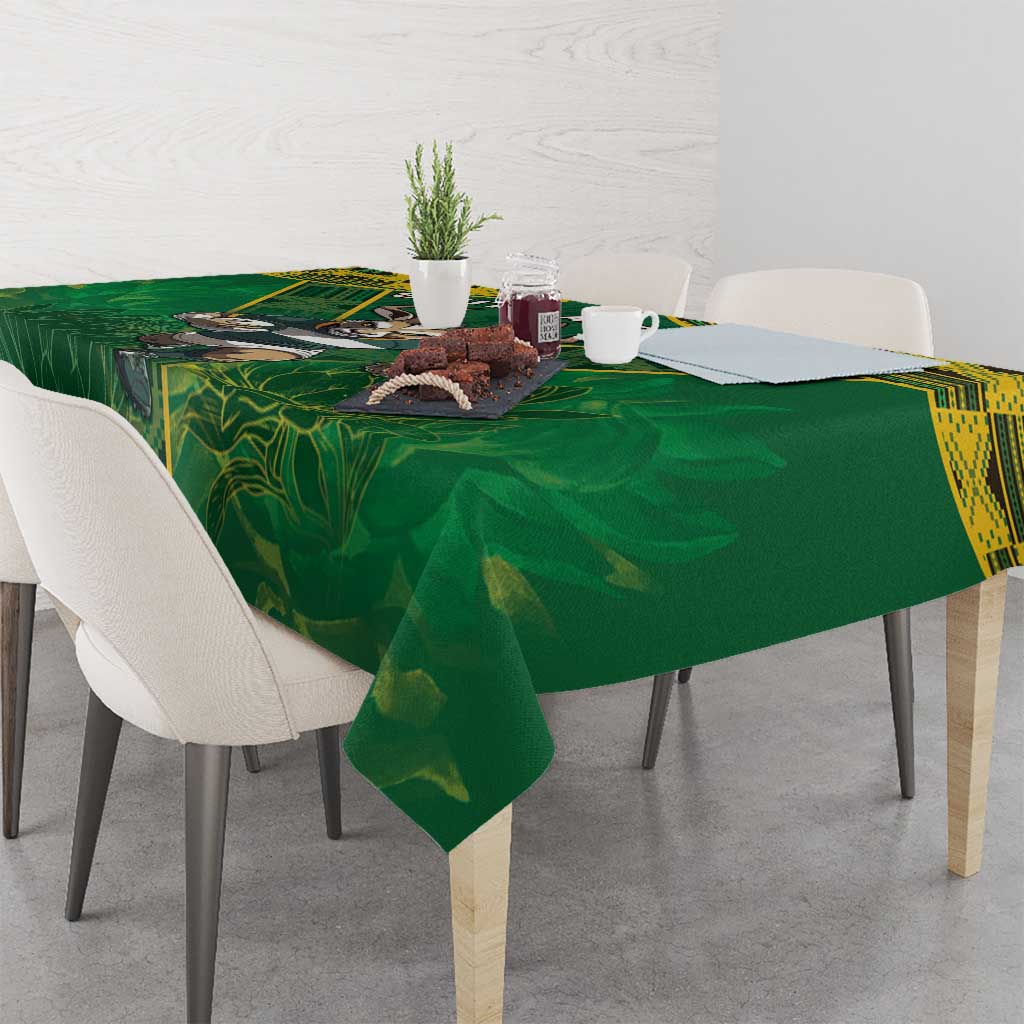 Green tablecloth with yellow edge and animal rugby crest on dining table