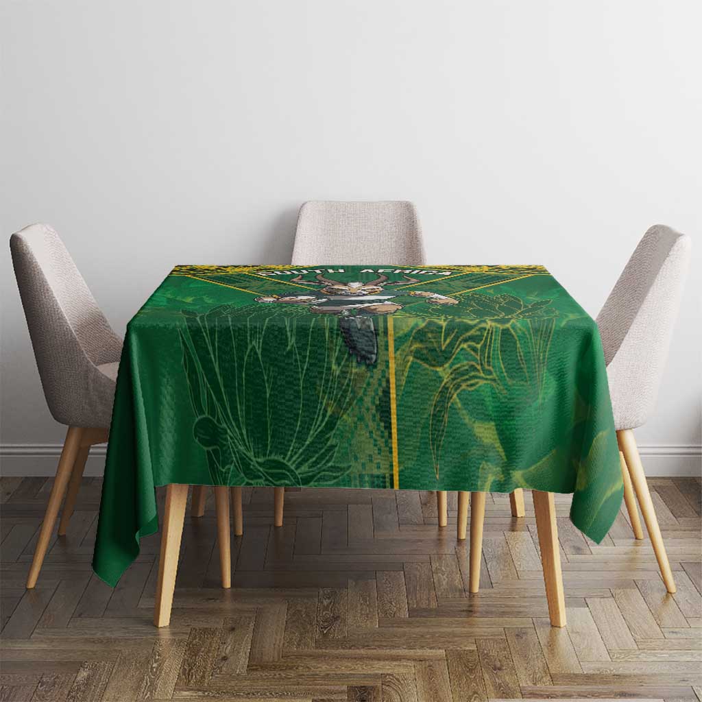 Green rugby tablecloth with yellow-trimmed wildlife graphic and corner drape
