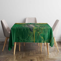 Green rugby tablecloth with yellow-trimmed wildlife graphic and corner drape