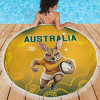 Yellow round beach blanket with white fringe, Australia text and kangaroo print on wooden deck