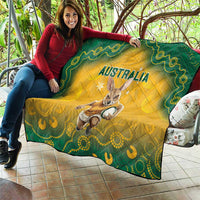 Yellow quilt blanket with green border, Australia text and kangaroo with ball graphic, quilted