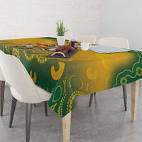 Yellow and green Aboriginal pattern tablecloth on dining table with decor