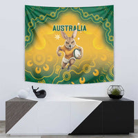 Wall tapestry with green patterned edge, yellow background, and kangaroo carrying soccer ball