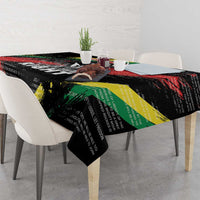 Black tablecloth draped on dining table with colorful diagonal stripes and text