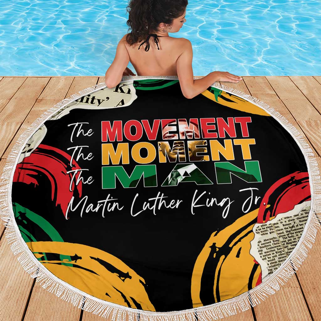 Round black beach blanket with fringe, “The Movement Moment Man” and MLK Jr text