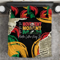 Black bedding set with bold red, green, and yellow graphic text design and quotes