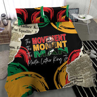Black bedding set showing centered “The MOVEMENT The MOMENT The MAN” graphic with quotes