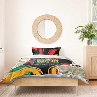 Black bedding set with red, green, and yellow artwork and centered “The MOVEMENT” wording