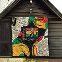 Black quilt with colorful swirls and portrait graphic, quilted texture hanging up