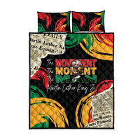 Black quilt bed set with matching pillow, red and green swirl pattern and “Movement Man” text