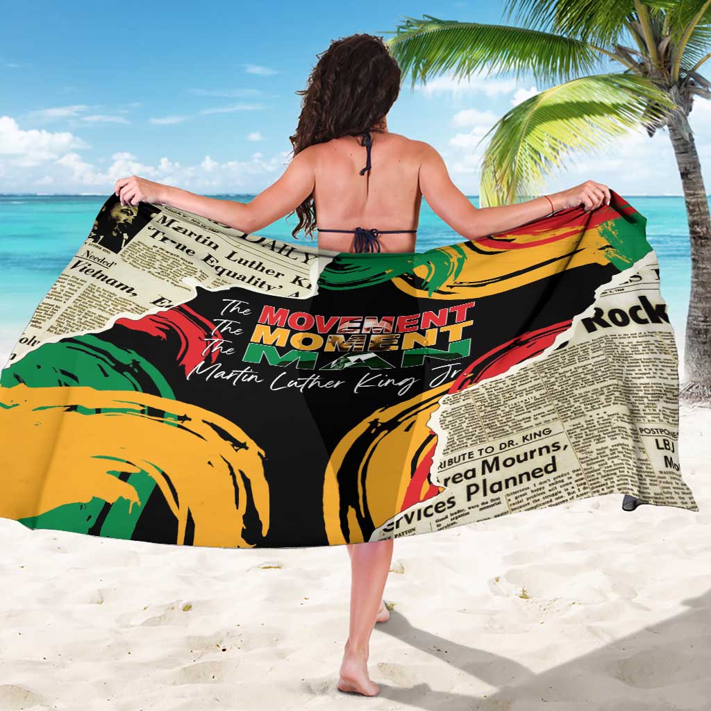 MLK legacy sarong spread wide with multicolor text blocks and yellow-green circular artwork