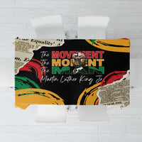 Rectangular black MLK tablecloth with colorful rally graphics and text collage.