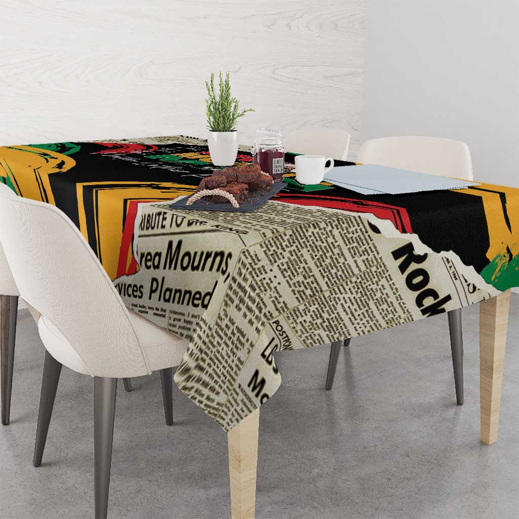 Black tablecloth with newspaper-style text blocks and red/green/yellow accents on table.