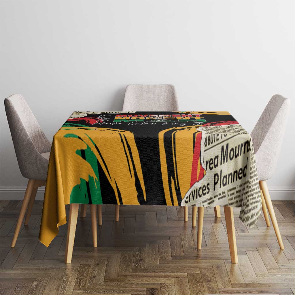 Black tablecloth with bold yellow stripe print and red/green accents on dining table.