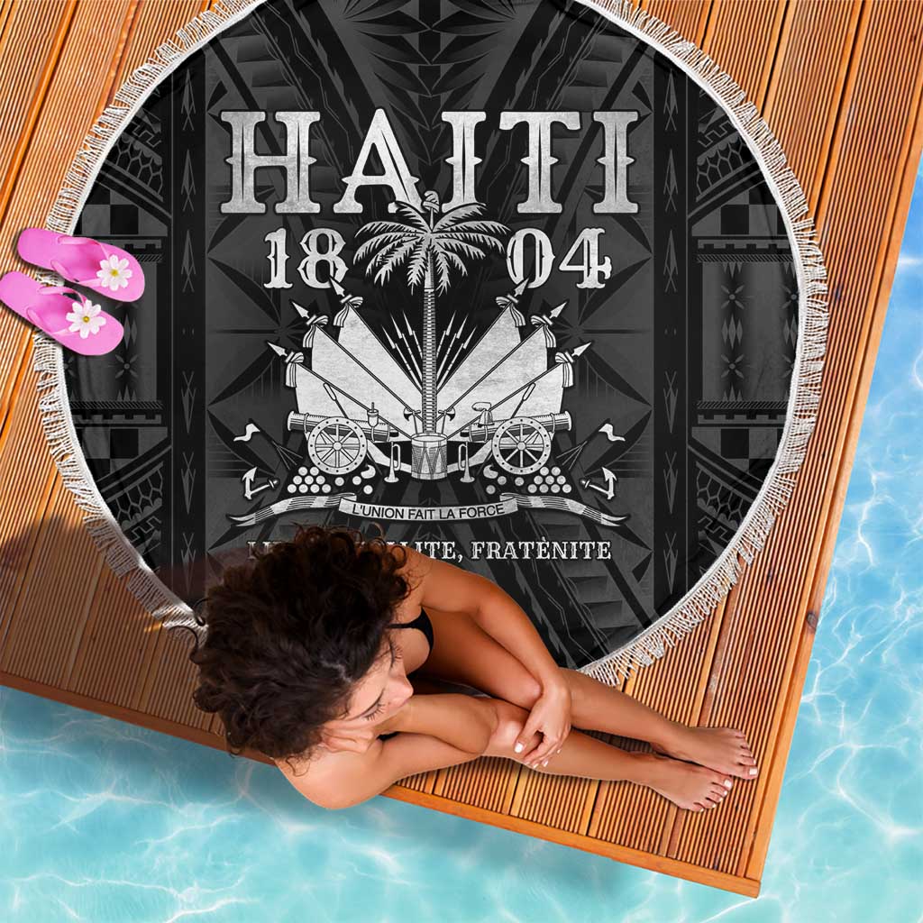 Fringed round beach blanket showing “HAITI 1804” text and crest design