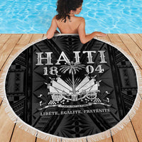Person on deck holding a round fringed beach blanket with Haiti 1804 artwork