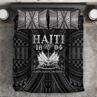 Black and white Haiti 1804-style duvet with bold central emblem and patterned borders.