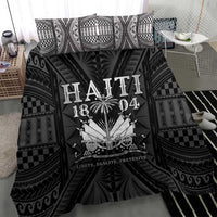 Close-up of black and white duvet featuring Haiti 1804-style emblem and decorative rays.