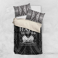Black and white duvet set with two matching pillows and Haiti 1804-style central emblem.