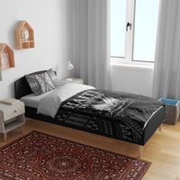 Black and white bedding set with patterned duvet and two decorative pillows featuring Haiti 1804.