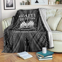 Black throw blanket draped on a sofa, “HAITI 1804” and crest medallion graphic