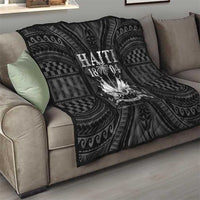 Haiti 1804 quilt draped over sofa, dark black with geometric bands and balloon graphic