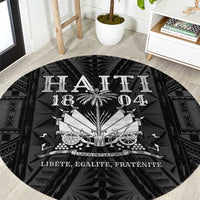 Round black carpet with white Haitian emblem graphic and text