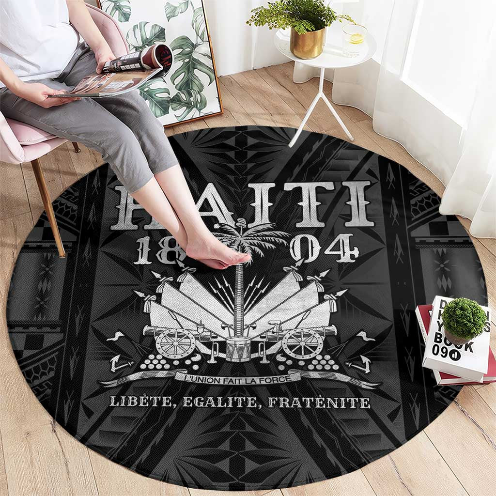 Round black carpet with white Haitian emblem graphic, full circular view