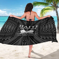 Black sarong laid out with Haiti 1804 print and patterned swirls, spread wide