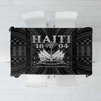 Black tablecloth with bold central crest, checker panels, and decorative geometric print.