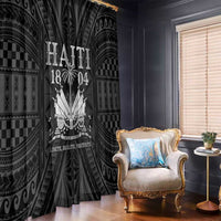 Window curtain panel with black-and-silver Polynesian style print, hanging beside window