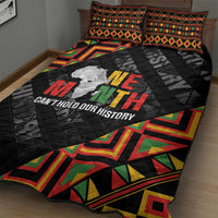 Black quilt bed set showing quilt texture, colorful edge pattern, and 'Can't hold our history' text
