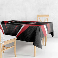 Black tablecloth with red and white chevron stripes, draped over table edge